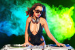 © stryjek - Beautiful DJ girl on decks on the party,