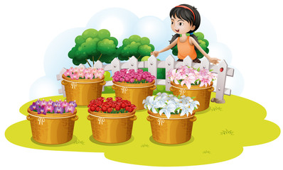 Poster - A girl looking at the flowers in the basket