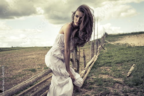 Young woman in white dress outdoor
