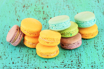 Macaroons on wooden table close-up