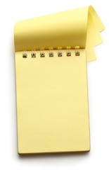 Wall Mural - Open yellow notepad on white