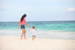© travnikovstudio - Young beautiful mother and her adorable little daughter running
