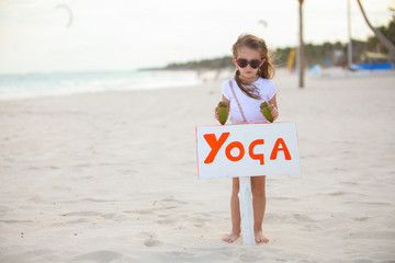 Canvas Print - Little cute girl enjoying vacations with two coconut on the