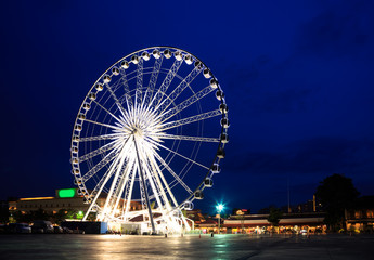 Spinning ferris wheel at twilight