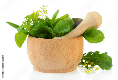 Fototapeta do kuchni Fresh herbs in mortar, isolated on white