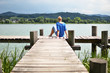 © HappyAlex - Girl on the wooden jetty. Switzerland