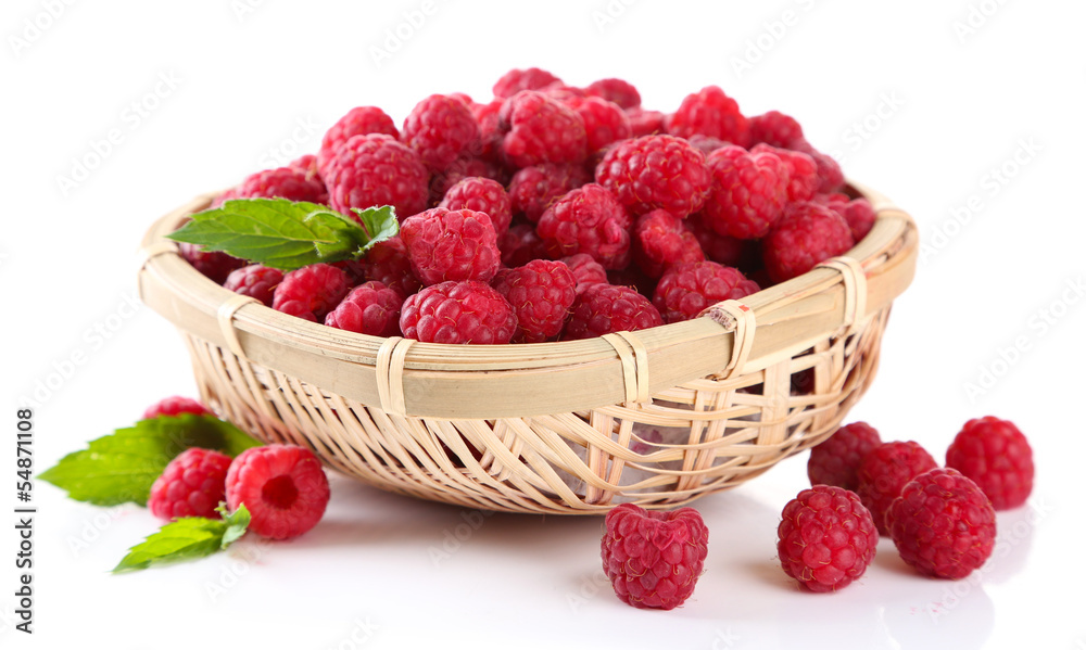 Ripe sweet raspberries in basket, isolated on white