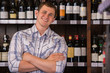 © Milles Studio - Portrait of confident male with a selection of wines in the back