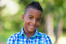 Outdoor Portrait Of A Cute Teenage Black Boy - African People