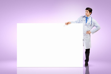 Wall Mural - Male doctor with banner