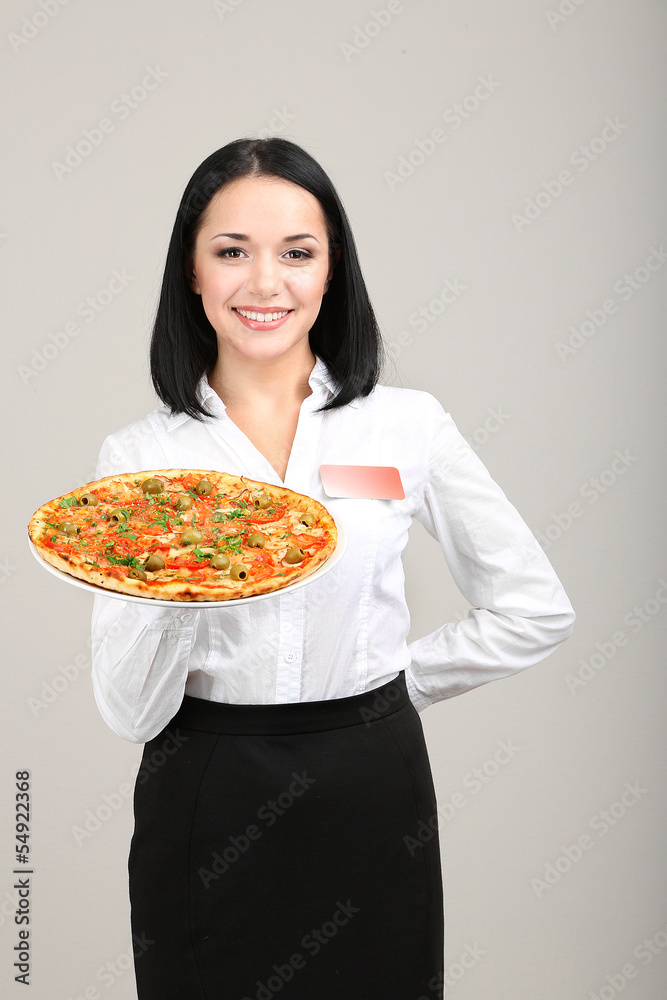 Beautiful girl waiter with pizza isolated on white