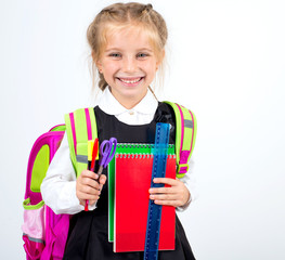 little cute girl with a stationery