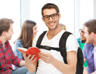 Wall Mural - student reading book at school