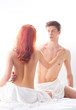 © Acronym - A lovely Caucasian couple posing naked in the bed
