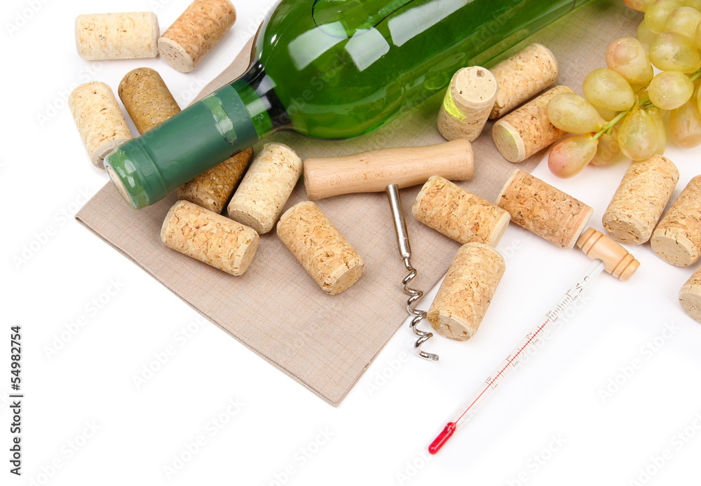 Bottle of wine, grapes and corks, isolated on white