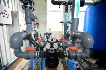 industrial barometers and water pipes in boiler room