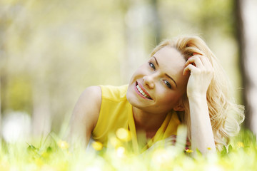 Wall Mural - Woman lying on grass