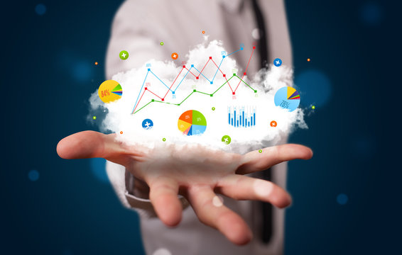 Young businessman presenting cloud with charts and graph icons a