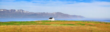 Panoramic View Of Beautiful Landscape With Old House In Iceland