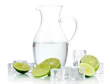 Glass Pitcher Of Water With Ice And Lime Isolated On White