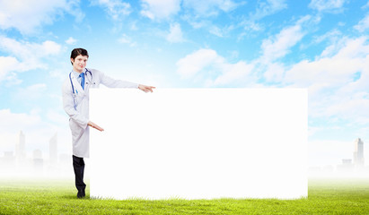 Wall Mural - Male doctor with banner