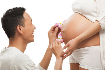 Wall Mural - Pregnant woman with her husband.