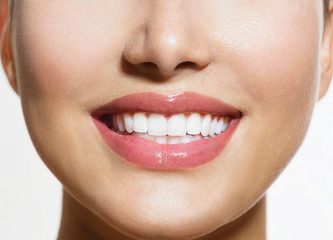 Wall Mural - Healthy Smile. Teeth Whitening. Smiling Young Woman