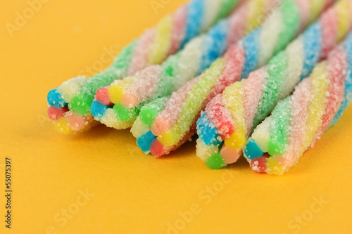 Tapeta ścienna na wymiar Sweet jelly candies on yellow background