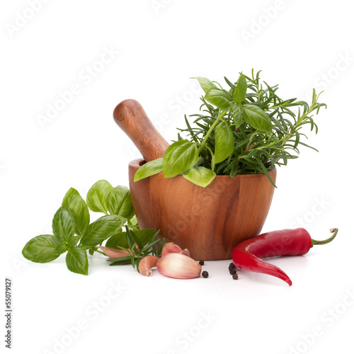 Naklejka ścienna fresh flavoring herbs and spices in wooden mortar