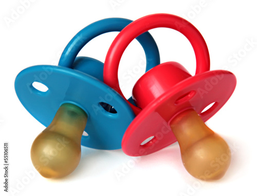 two baby's dummy red and blue isolated on white background. Fototapeta