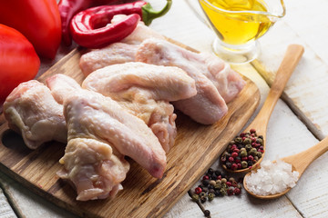 Wall Mural - Fresh chicken on wooden table