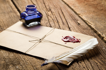 Wall Mural - Old feather, envelope, sealing wax and ink bottle