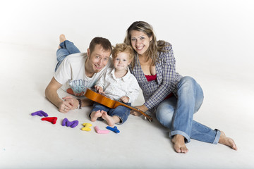 Happy family with cute toddler isolated on white