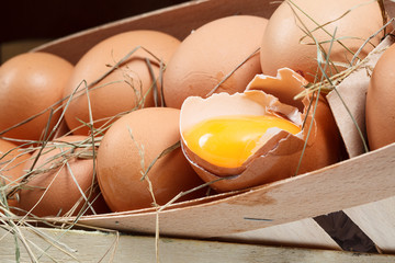 Wall Mural - Chicken eggs with broken egg