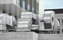 Industrial Air Conditioning And Ventilation Systems On A Roof