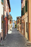 Fototapeta Uliczki - Narrow street in the old town of Rimini