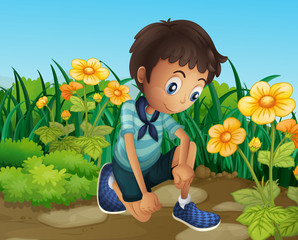 Poster - A sad boy near the blooming flowers