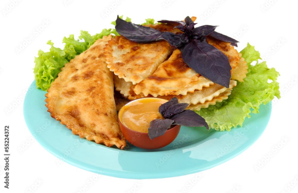 Tasty cheburek with fresh herbs on plate, isolated on white