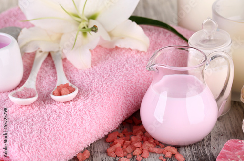 Naklejka na meble Beautiful spa setting with lily on wooden table close-up