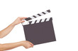 human hand holding a movie clapboard