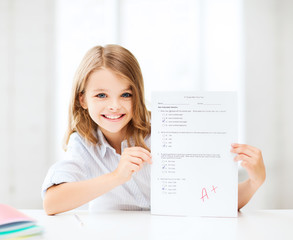 Canvas Print - girl with test and A grade at school