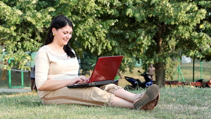 Wall Mural - happy girl typing on laptop