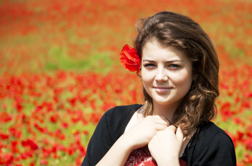 Wall Mural - Young Woman  in Poppy Field