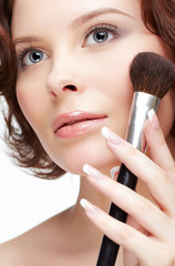 woman with makeup brush