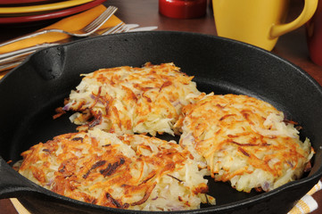 Sticker - Potato latkes in a cast iron skillet