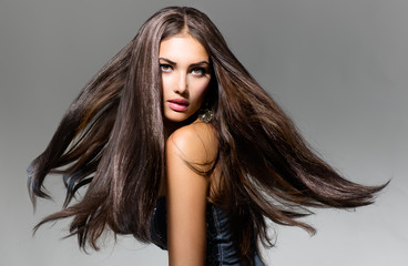 Fashion Model Girl Portrait with Long Blowing Hair