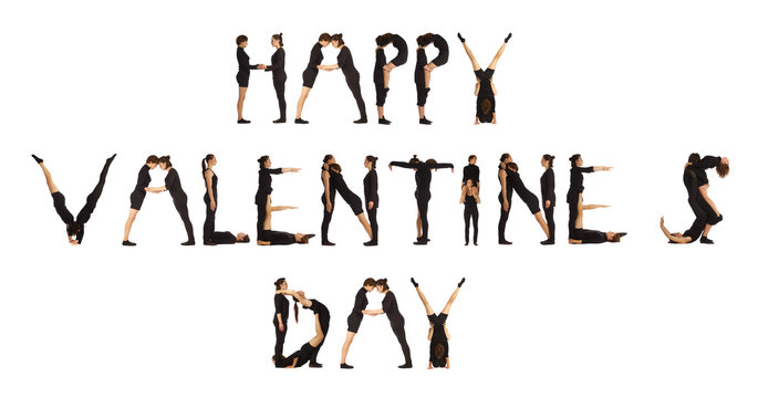Group of black dressed people forming HAPPY VALENTINES DAY word