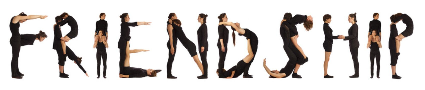Group of black dressed people standing forming FRIENDSHIP word