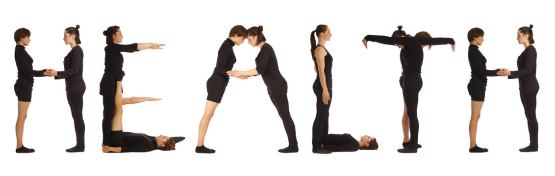 Group of black dressed people standing forming HEALTH word