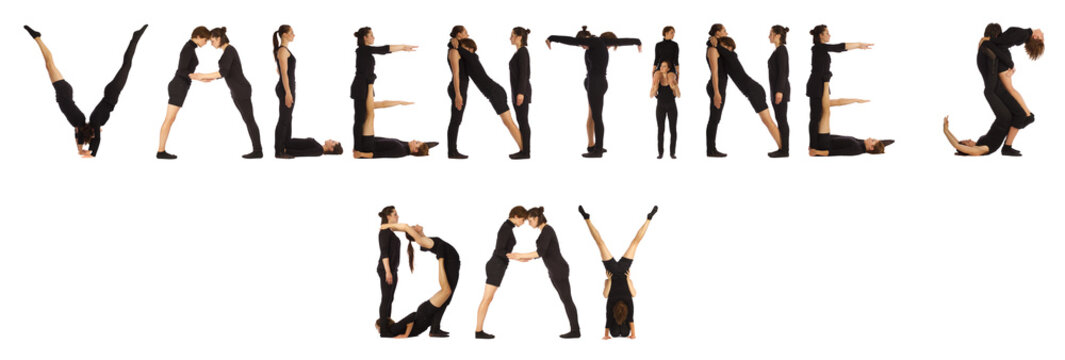 people standing over white forming VALENTINEs DAY words